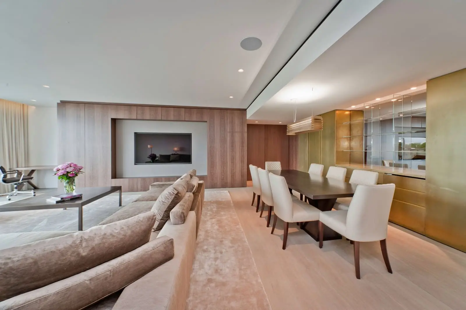 Professional commercial reception area with modern wood paneling and sophisticated lighting